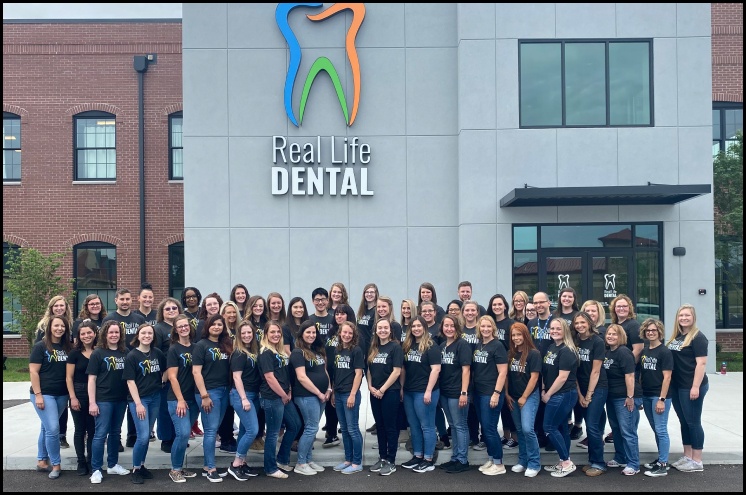 Real Life Dental staff outside the practice building